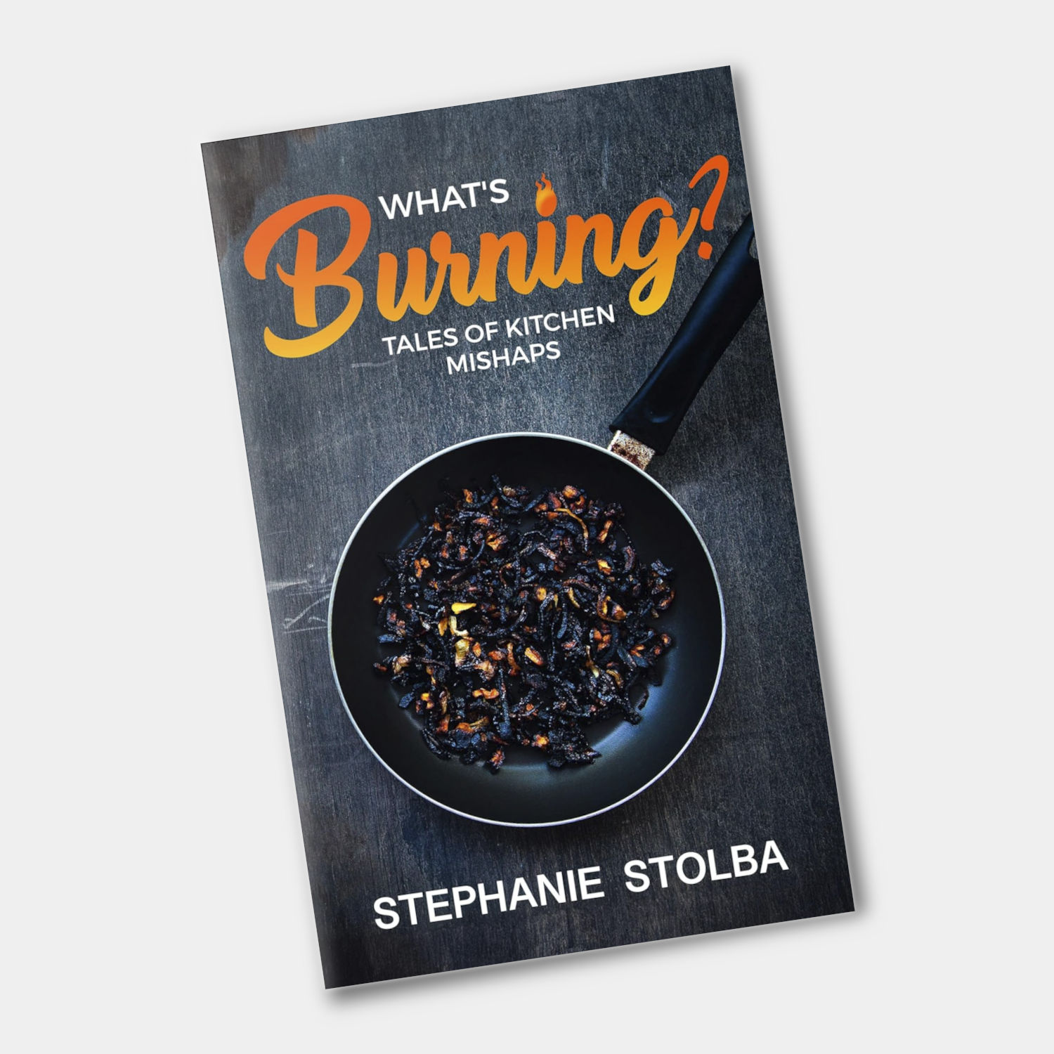 book cover for What's Burning by Stephanie Stolba, showing a frying pan with burnt food